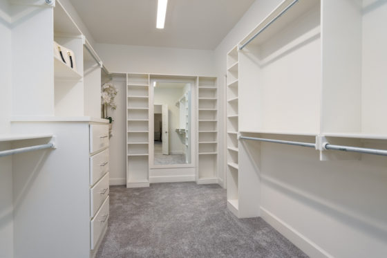 Primary closet with built-in shelving